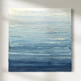 A blue, beige, lavender and light yellow textured abstract painting by Teodora Guererra hangs on a white wall.