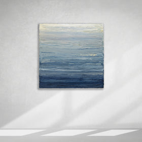 A blue, beige, lavender and light yellow textured abstract painting by Teodora Guererra hangs on a white wall.