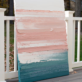 A peach, coral, white and teal with lavender thick textured painting leaning outside on a deck in natural light by Teodora Guererra.