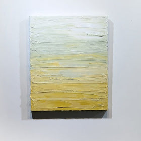 A Yellow, seafoam green and white textured painting by Teo Guererra hangs on a wall