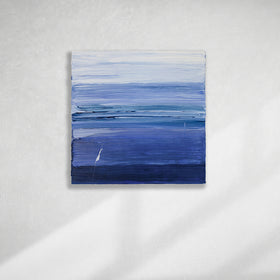 A blue and white textured abstract painting by Teodora Guererra hangs on a white wall.
