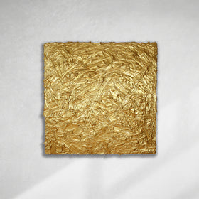 A metallic gold thick textured painting on a white wall in natural light by Teodora Guererra.