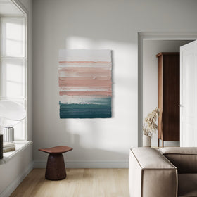 Modern living room with abstract painting on the wall, neutral decor, and a side table.