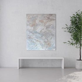 An abstract painting with thickly textured brushstrokes of beige, green, orange, and blue is hung in a modern room with floor to ceiling windows and a potted tree to the right.