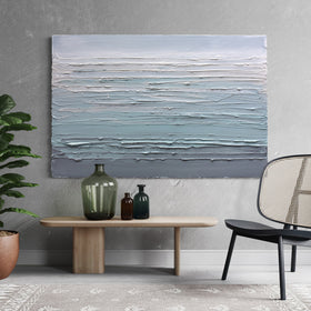 Modern interior with a original abstract painting buy Teo Guererra, table, chairs, and plants.