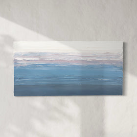 A blue, light pink, coral and white thickly textured abstract painting hanging on a white wall in natural light by Teodora Guererra.