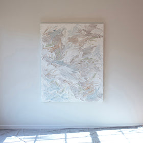 A thick textured impasto abstract painting with large brush strokes hanging on the artists studio wall.