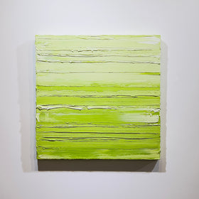 A chartreuse green and white textured abstract painting by Teodora Guererra hangs on a white wall.