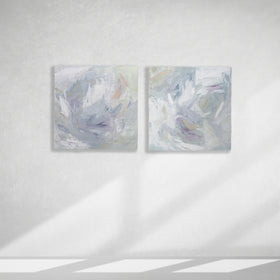 A pair of thickly painted paintings in teal, sea foam green, celadon, white, lavender and yellow by Teodora Guererra hang on a white wall.