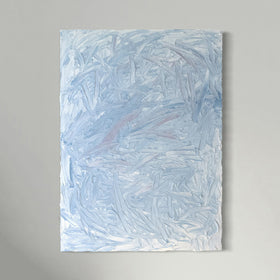 A blue and white textured painting hangs on a white wall.