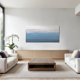 Modern living room featuring a large original abstract painting by Teo Guererra on the wall, white sofa, wooden coffee table, and potted plant.