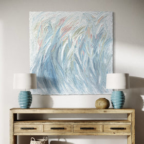 Wooden console table with decorative items featuring and original Teo Guererra abstract painting above it.