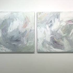 A video of a pair of thickly painted paintings in teal, sea foam green, celadon, white, lavender and yellow by Teodora Guererra hang on a white wall.