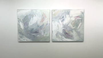 A video of a pair of thickly painted paintings in teal, sea foam green, celadon, white, lavender and yellow by Teodora Guererra hang on a white wall.