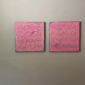 A video of two square pink text based paintings with writing into the surface with various tools, carving fluid script that reveals the teal color hidden below. Displayed side-by-side on a white wall.