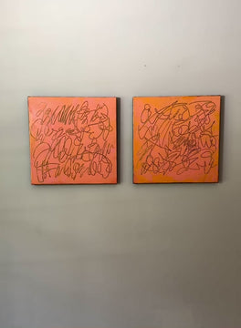 A video of two abstract text based paintings in orange and pink tones hanging on a white wall.