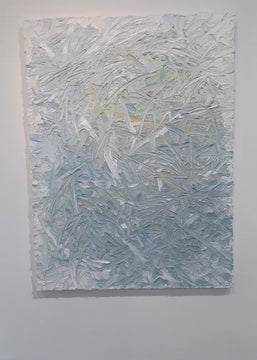 A video of an original abstract textured painting by Teodora Guererra with blue and white tones hanging on a white wall.