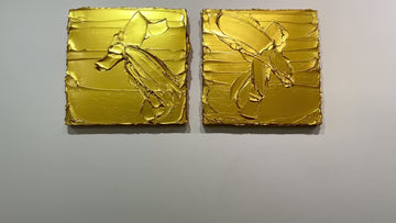 A video of a pair of golden textured paintings by Teodora Guererra hanging on a gallery wall.