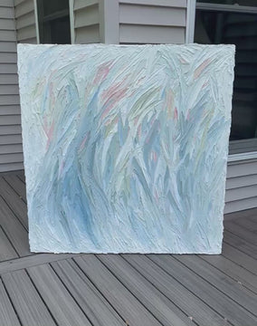 A video of an original abstract painting by Teo Guererra on a wooden deck at her studio.