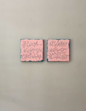 A video of two square abstract texted based paintings with pink backgrounds, teal textured brushstrokes, and teal line-like calligraphic forms, displayed side by side on a white wall.
