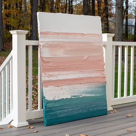 A peach, coral, white and teal with lavender thick textured painting leaning outside on a deck in natural light by Teodora Guererra.