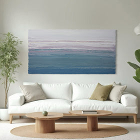 Modern living room with a white sofa, wooden coffee table, and original abstract painting by Teo Guererra.