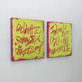 Two square abstract text-based paintings with textured chartreuse over hot raspberry pink  graffiti-style lettering, displayed side-by-side on a white wall, side view.