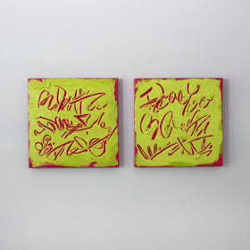 Two square abstract text-based paintings with textured chartreuse over hot raspberry pink  graffiti-style lettering, displayed side-by-side on a white wall.