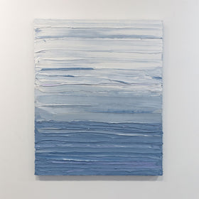 A painting is hanging on a wall. Its surface is decorated with blue and white paint in thick impasto streaks. Wired and ready to hang.
